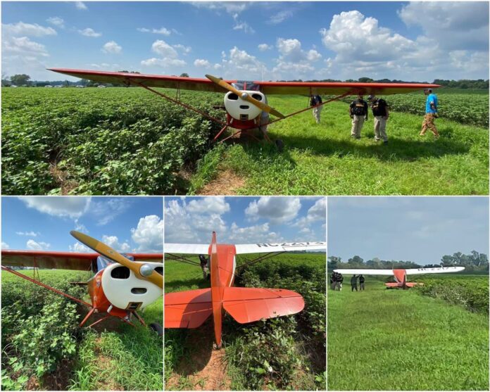 Aircraft lands in field