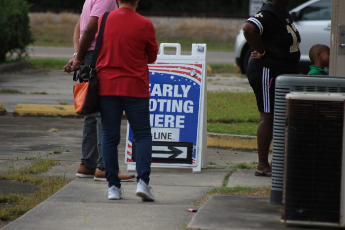 Voters in Baker, La., wait in line to cast ballots on the last day of Louisiana’s early voting period Tuesday, Nov. 1, 2022. (Photo credit: WES MULLER/LOUISIANA ILLUMINATOR)