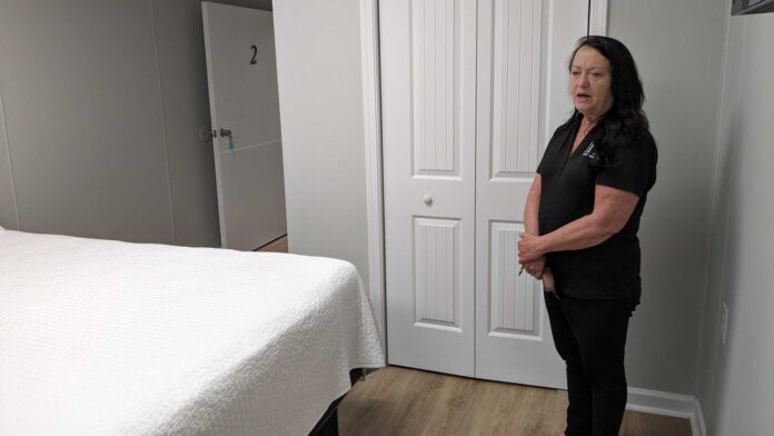 Patti Joy Freeman, executive director at Iris Domestic Violence Center, shows one of the new rooms she had hoped to open with additional state funding she received this year. (Julie O’Donoghue/Louisiana Illuminator)